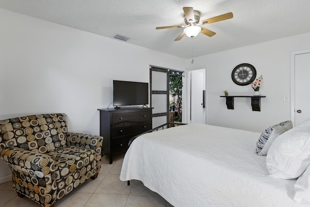 5625 Lakeview Mews Ct, Boynton Beach, FL 33437 - bedroom featuring light tile patterned floors, ceiling fan, and a textured ceiling