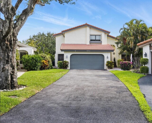 5625 Lakeview Mews Ct, Boynton Beach, FL 33437 - mediterranean / spanish home with driveway, a tile roof, stucco siding, and a garage