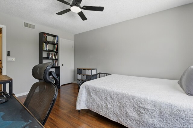 5625 Lakeview Mews Ct, Boynton Beach, FL 33437 - bedroom with wood finished floors, baseboards, a desk, ceiling fan, and a textured ceiling