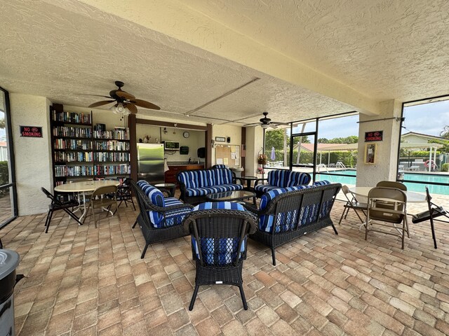 5625 Lakeview Mews Ct, Boynton Beach, FL 33437 - view of patio featuring ceiling fan, outdoor lounge area, and a community pool