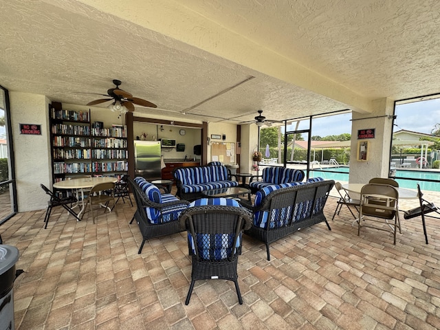 5625 Lakeview Mews Ct, Boynton Beach, FL 33437 - view of patio featuring ceiling fan, an outdoor hangout area, and a community pool