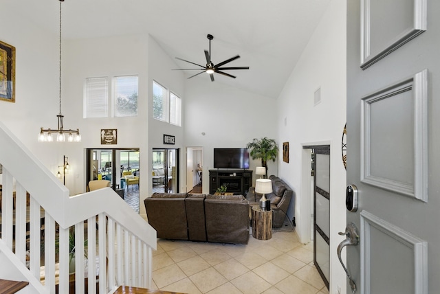 5625 Lakeview Mews Ct, Boynton Beach, FL 33437 - living room featuring high vaulted ceiling, ceiling fan, light tile patterned floors, a chandelier, and stairway