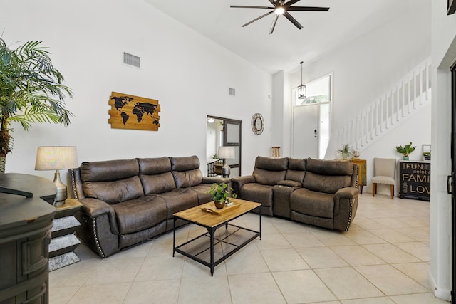 5625 Lakeview Mews Ct, Boynton Beach, FL 33437 - living area with high vaulted ceiling, ceiling fan, light tile patterned floors, and stairway
