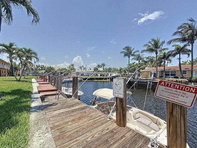 301 E Mcnab Rd Unit 214, Pompano Beach, FL 33060 - dock area featuring a water view and a yard