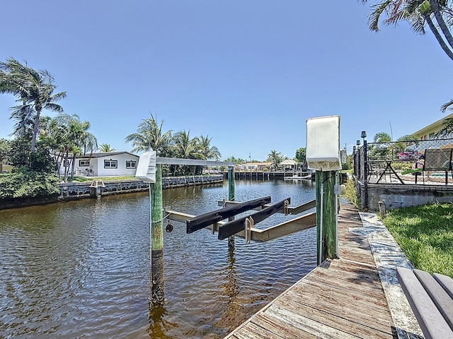301 E Mcnab Rd Unit 214, Pompano Beach, FL 33060 - dock with boat lift and a water view