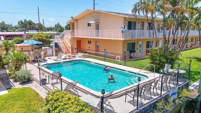 301 E Mcnab Rd Unit 214, Pompano Beach, FL 33060 - community pool featuring stairs and a patio area