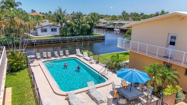 301 E Mcnab Rd Unit 214, Pompano Beach, FL 33060 - community pool featuring a water view and a patio area