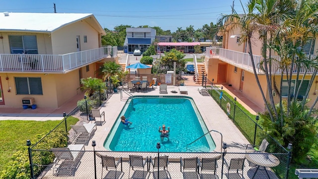 301 E Mcnab Rd Unit 214, Pompano Beach, FL 33060 - community pool featuring stairway and a patio