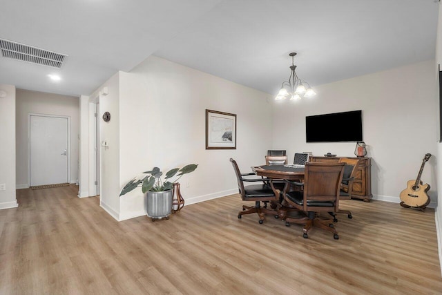2640 Lake Shore Dr Unit 2409, Riviera Beach, FL 33404 - dining room with light wood-style floors, baseboards, a chandelier, and a desk