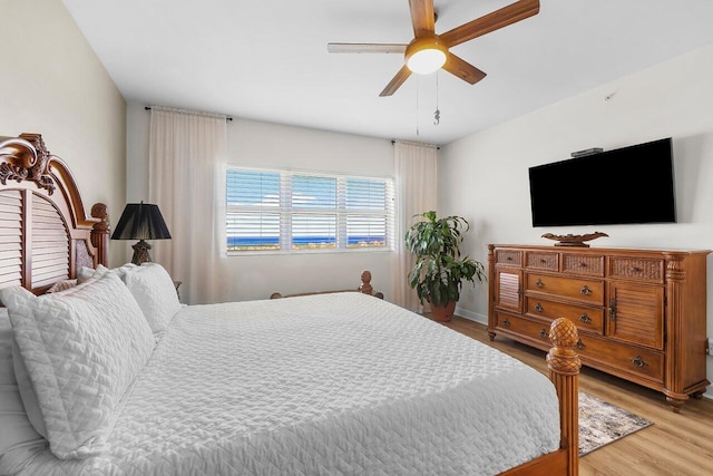 2640 Lake Shore Dr Unit 2409, Riviera Beach, FL 33404 - bedroom featuring light wood-style floors and ceiling fan