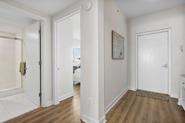 2640 Lake Shore Dr Unit 2409, Riviera Beach, FL 33404 - hallway with wood finished floors and baseboards
