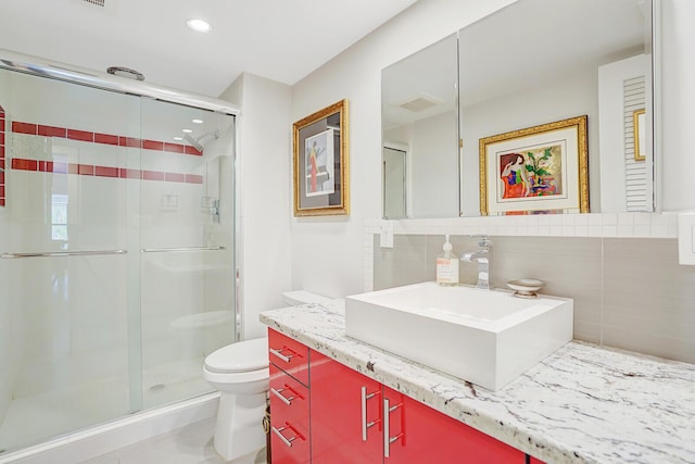 102 Clubhouse Cir, Jupiter, FL 33477 - bathroom featuring vanity, toilet, a shower stall, recessed lighting, and decorative backsplash