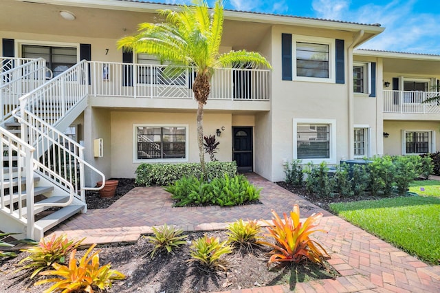 7 Stratford Dr Unit C, Boynton Beach, FL 33436 - view of building exterior featuring stairs