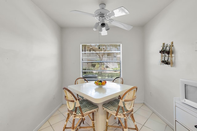 7 Stratford Dr Unit C, Boynton Beach, FL 33436 - dining room featuring light tile patterned flooring, a ceiling fan, and baseboards