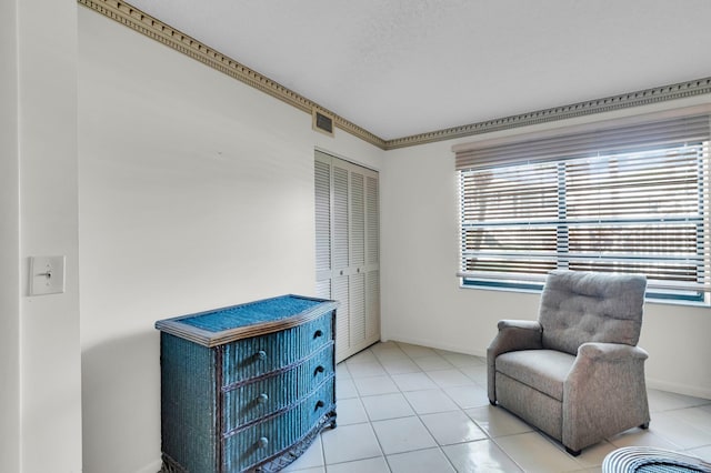 7 Stratford Dr Unit C, Boynton Beach, FL 33436 - living area featuring healthy amount of natural light and light tile patterned floors