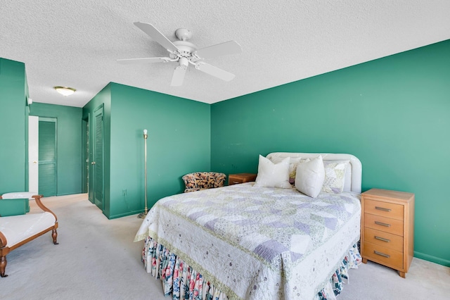 7 Stratford Dr Unit C, Boynton Beach, FL 33436 - carpeted bedroom with a closet, ceiling fan, a textured ceiling, and baseboards