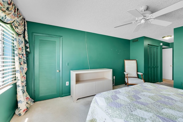 7 Stratford Dr Unit C, Boynton Beach, FL 33436 - bedroom featuring carpet, a textured ceiling, and ceiling fan