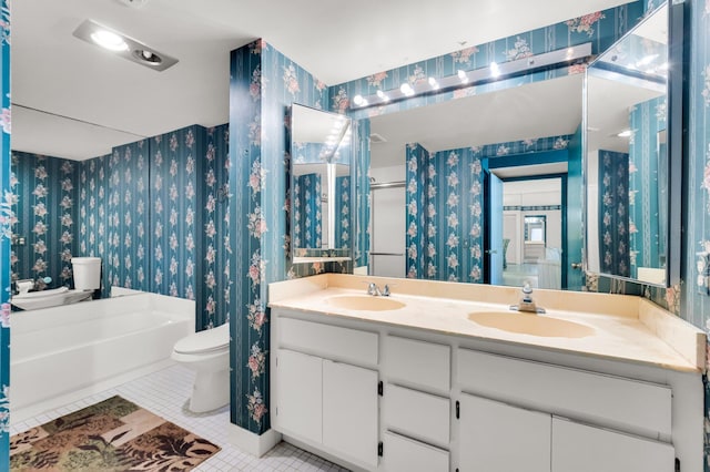 7 Stratford Dr Unit C, Boynton Beach, FL 33436 - bathroom featuring wallpapered walls, toilet, tile patterned floors, double vanity, and a bath