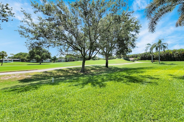 7 Stratford Dr Unit C, Boynton Beach, FL 33436 - surrounding community with golf course view and a yard