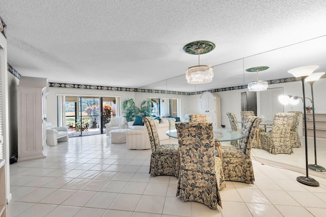 7 Stratford Dr Unit C, Boynton Beach, FL 33436 - dining space with a textured ceiling and light tile patterned floors