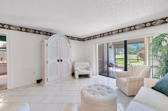 7 Stratford Dr Unit C, Boynton Beach, FL 33436 - living area featuring a textured ceiling and light tile patterned floors