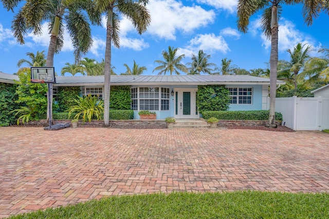 4040 Gem Lake Dr, Glen Ridge, FL 33406 - ranch-style home with a gate, metal roof, stucco siding, and french doors