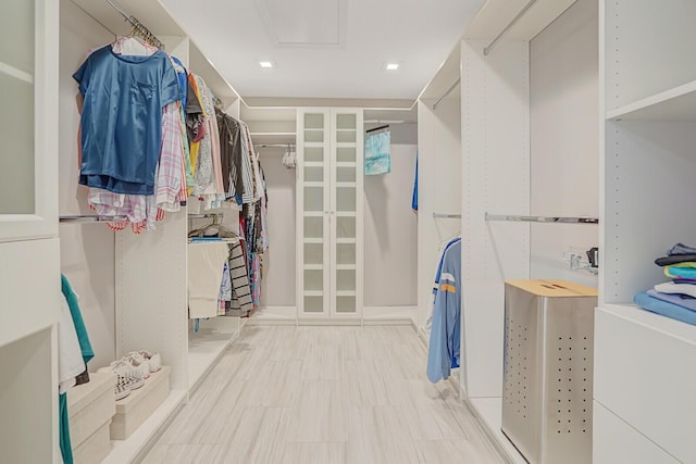 4040 Gem Lake Dr, Glen Ridge, FL 33406 - walk in closet featuring attic access