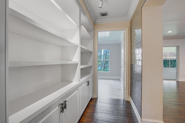 4040 Gem Lake Dr, Glen Ridge, FL 33406 - hallway with crown molding, baseboards, and dark wood-style flooring