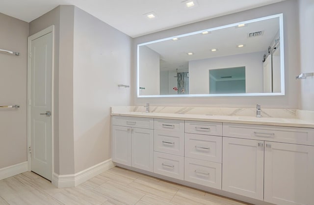 4040 Gem Lake Dr, Glen Ridge, FL 33406 - full bathroom with double vanity and baseboards