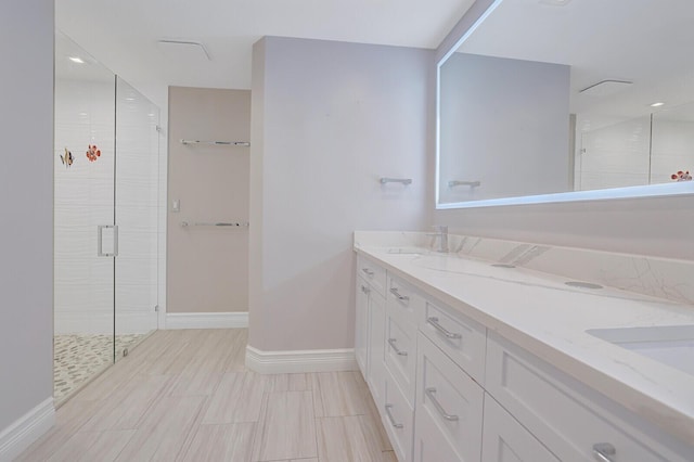 4040 Gem Lake Dr, Glen Ridge, FL 33406 - bathroom featuring a stall shower, double vanity, and baseboards