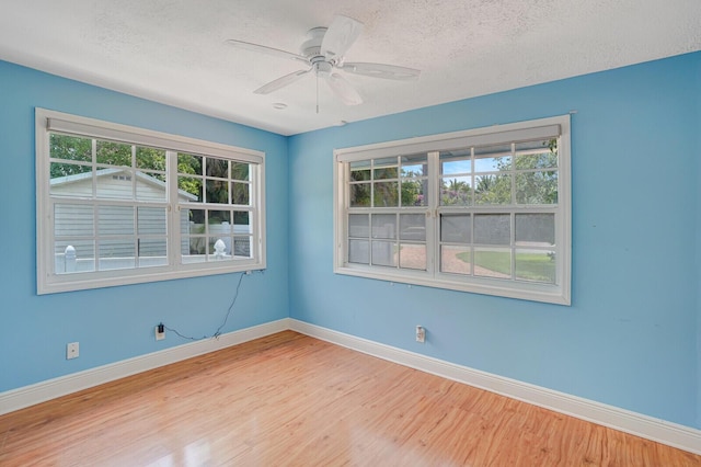 4040 Gem Lake Dr, Glen Ridge, FL 33406 - unfurnished room with wood finished floors, baseboards, a textured ceiling, and ceiling fan