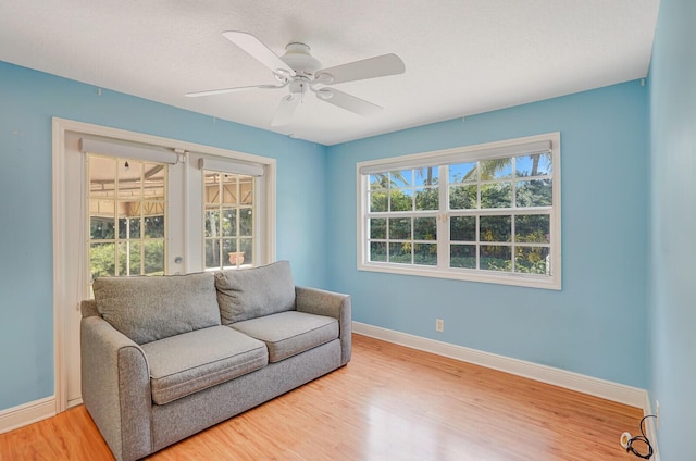 4040 Gem Lake Dr, Glen Ridge, FL 33406 - sitting room with baseboards, wood finished floors, and ceiling fan