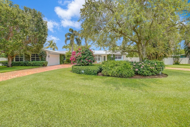4040 Gem Lake Dr, Glen Ridge, FL 33406 - view of front facade featuring a garage and driveway