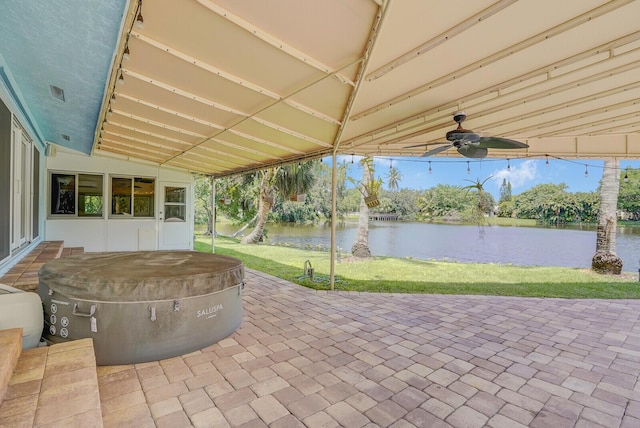 4040 Gem Lake Dr, Glen Ridge, FL 33406 - view of patio featuring a hot tub, a water view, and a ceiling fan