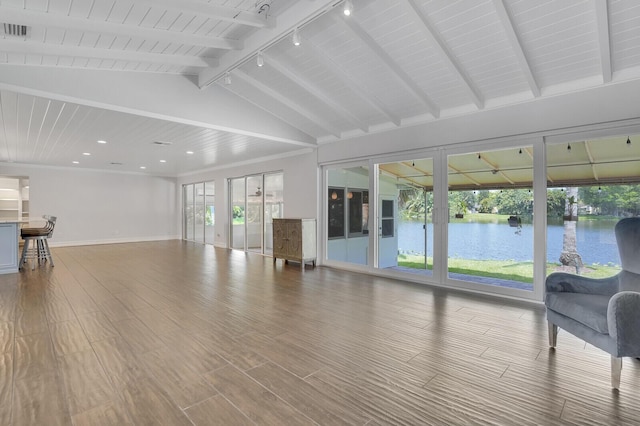 4040 Gem Lake Dr, Glen Ridge, FL 33406 - living room featuring rail lighting, baseboards, recessed lighting, wood finished floors, and a water view