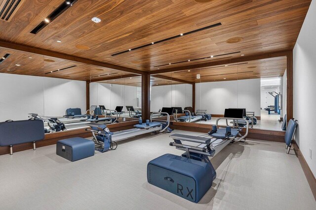 220 SE Mizner Blvd Unit 409, Boca Raton, FL 33432 - gym with wood ceiling and carpet flooring