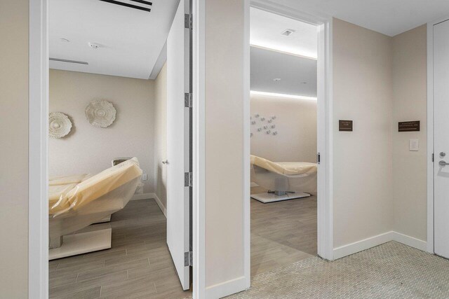 220 SE Mizner Blvd Unit 409, Boca Raton, FL 33432 - corridor with light wood-type flooring and baseboards