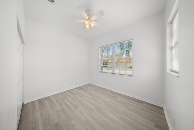 296 NW Toscane Trl, Port Saint Lucie, FL 34986 - empty room featuring light wood-type flooring, a ceiling fan, and baseboards