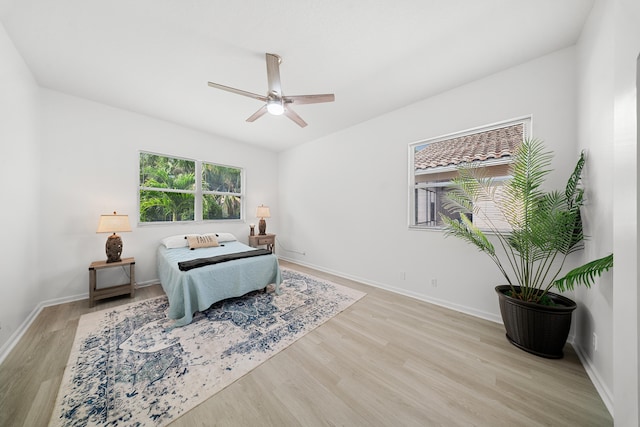 296 NW Toscane Trl, Port Saint Lucie, FL 34986 - bedroom with wood finished floors, baseboards, and a ceiling fan