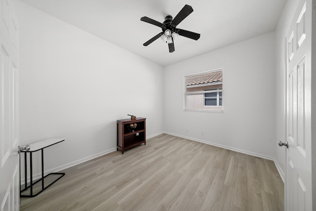 296 NW Toscane Trl, Port Saint Lucie, FL 34986 - empty room featuring light wood-style floors, baseboards, and a ceiling fan