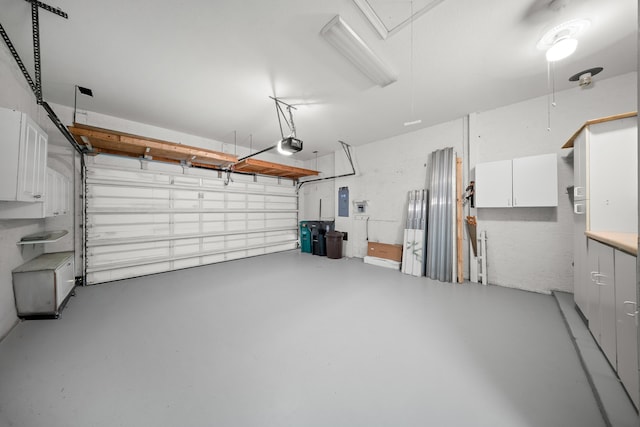 296 NW Toscane Trl, Port Saint Lucie, FL 34986 - garage with a garage door opener and electric panel