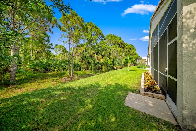 296 NW Toscane Trl, Port Saint Lucie, FL 34986 - view of grassy yard featuring glass enclosure