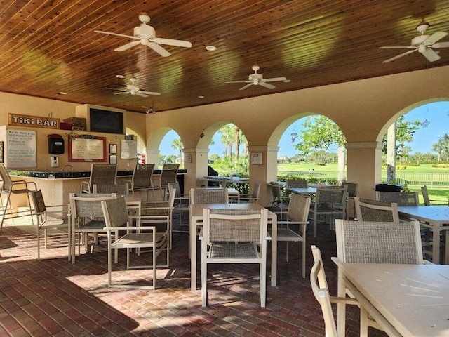 296 NW Toscane Trl, Port Saint Lucie, FL 34986 - view of patio featuring ceiling fan, outdoor dining space, and a bar