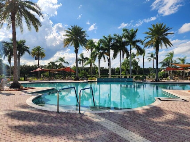 296 NW Toscane Trl, Port Saint Lucie, FL 34986 - community pool featuring a patio area