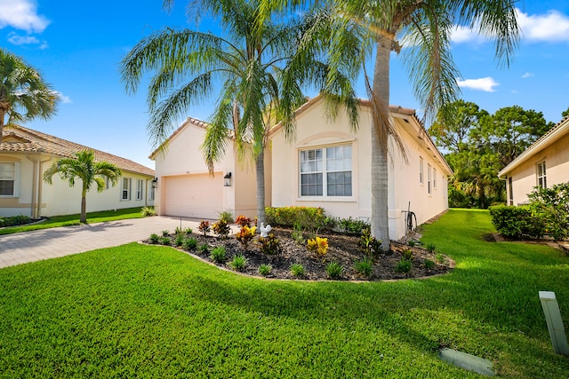 296 NW Toscane Trl, Port Saint Lucie, FL 34986 - mediterranean / spanish-style home featuring driveway, an attached garage, stucco siding, and a front lawn