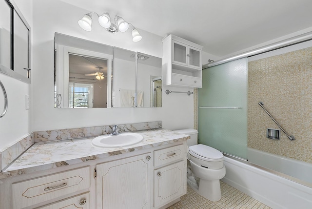 222 Wellington Unit G, West Palm Beach, FL 33417 - full bathroom featuring toilet, vanity, shower / bath combination with glass door, a ceiling fan, and tile patterned floors