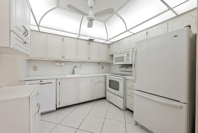 222 Wellington Unit G, West Palm Beach, FL 33417 - kitchen with white appliances, a sink, light countertops, a ceiling fan, and light tile patterned floors