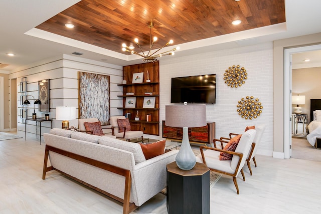 17155 SW Ambrose Way, Port Saint Lucie, FL 34986 - living area with a tray ceiling, wood ceiling, light wood finished floors, and a chandelier