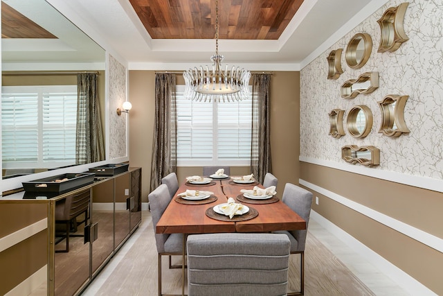 17155 SW Ambrose Way, Port Saint Lucie, FL 34986 - dining room featuring a raised ceiling, a chandelier, wooden ceiling, wood finished floors, and baseboards