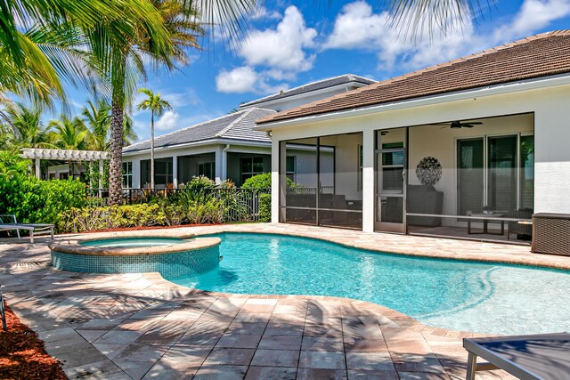 17155 SW Ambrose Way, Port Saint Lucie, FL 34986 - view of pool with a sunroom, ceiling fan, a patio, and a pool with connected hot tub